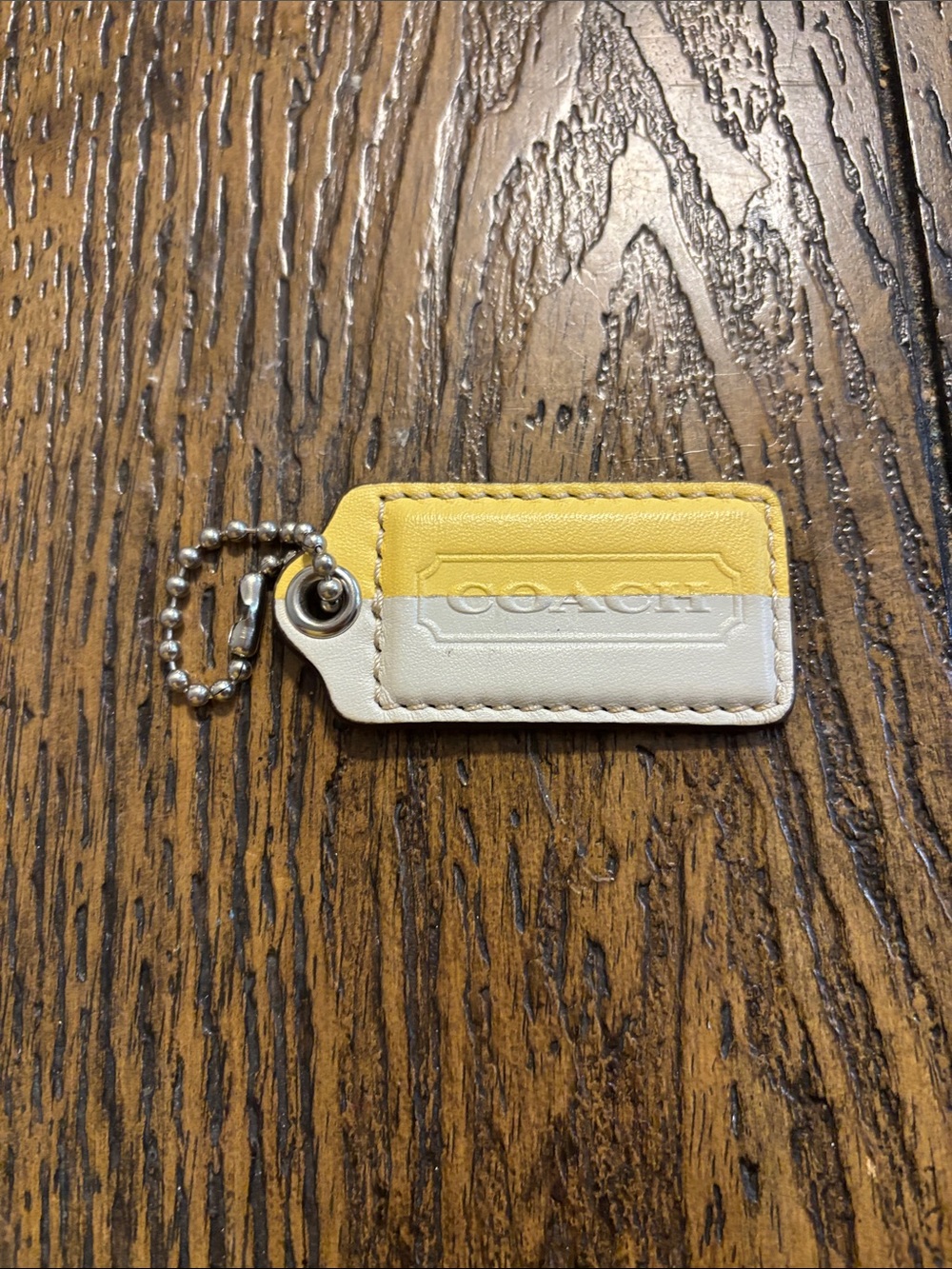 Coach White and Yellow hang tag